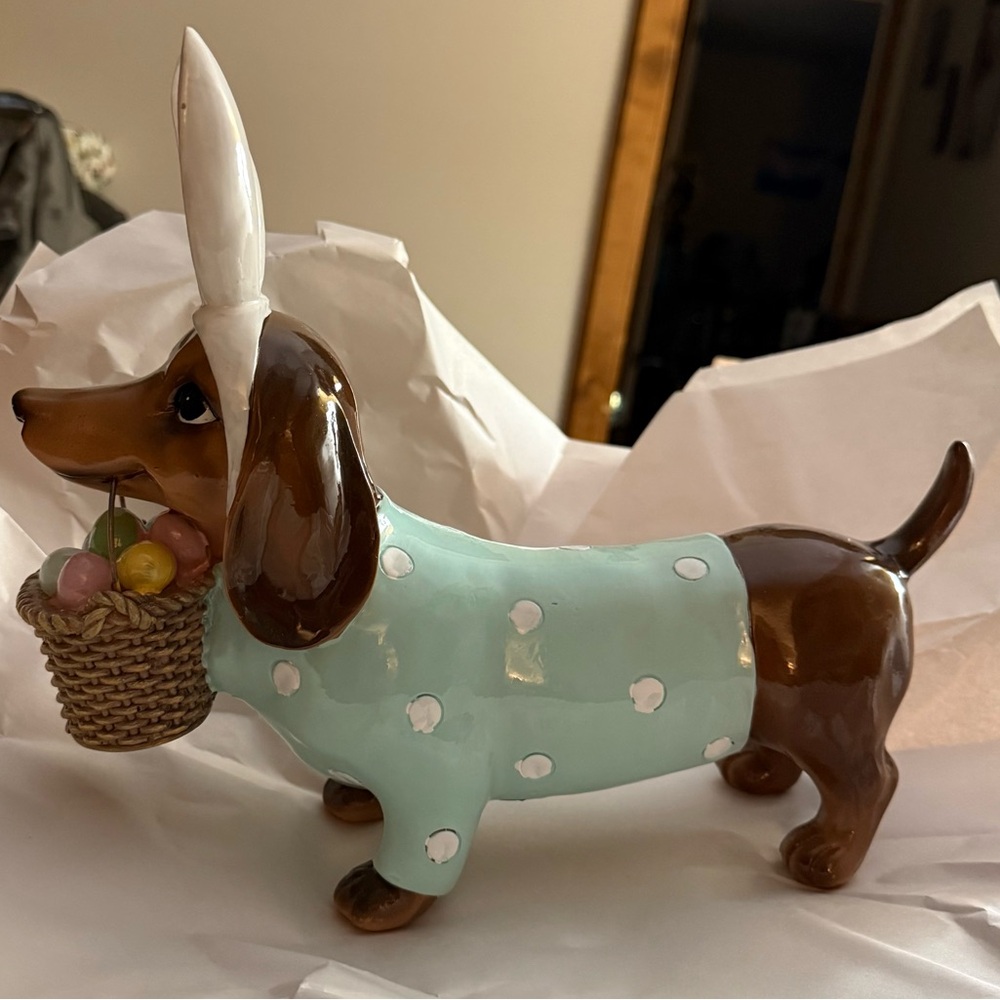 Easter dash hound, carrying Easter basket, wearing bunny ears
